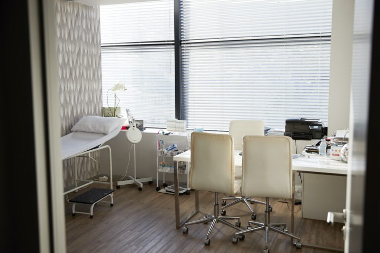 Empty Doctors Office Viewed Through Open Door