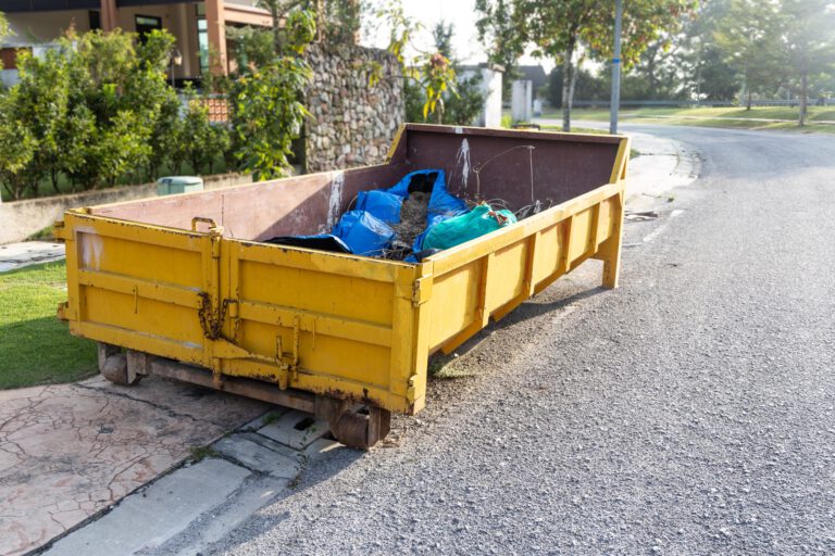 Garbage roro dumpter bin collects rubbish at construction site